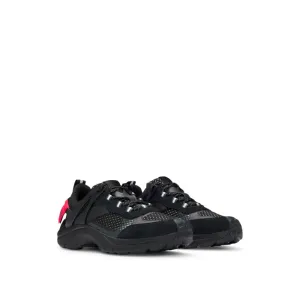 Mixed-material trainers with decorative reflective effects