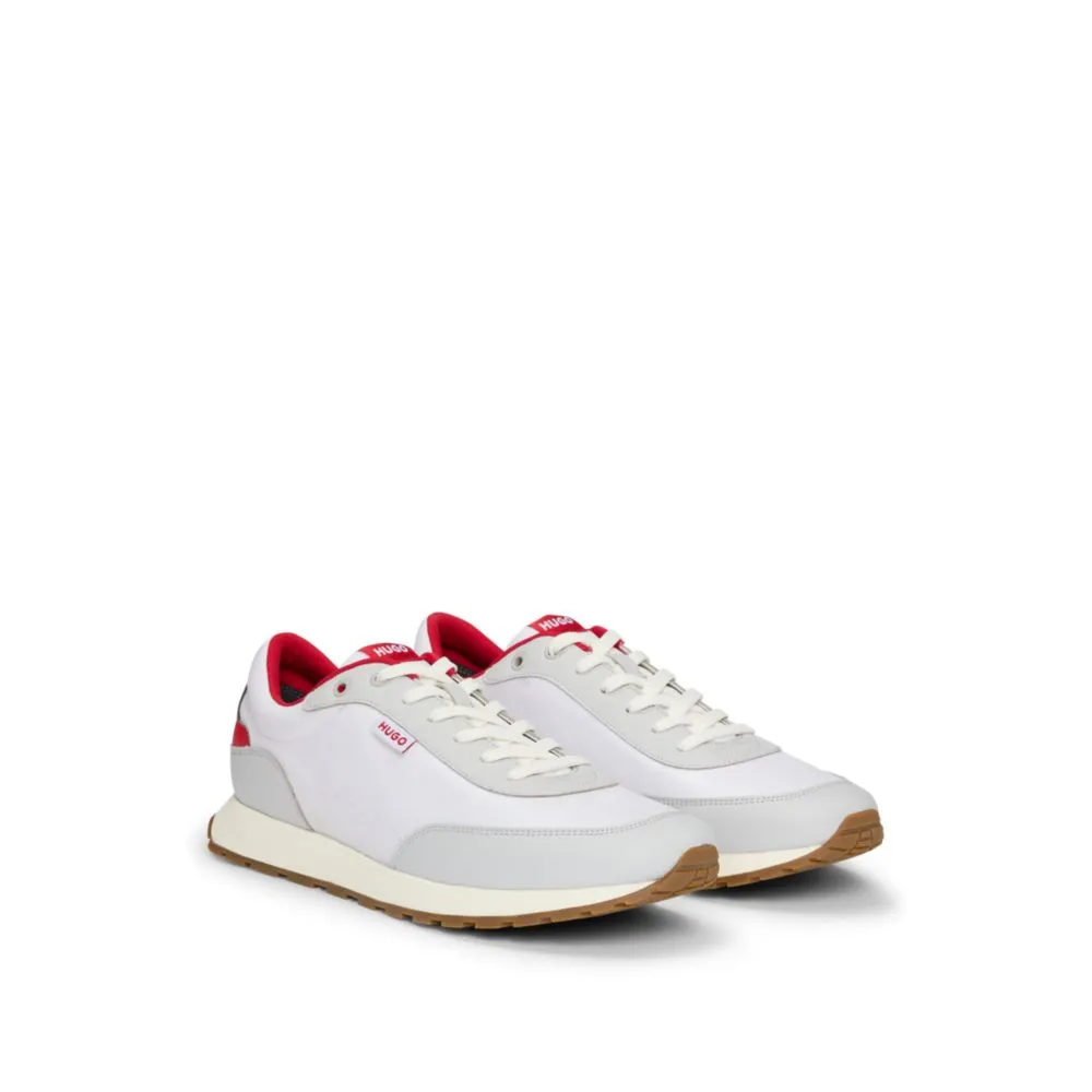 Mixed-material trainers with logo flag